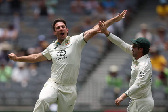 Mitchell Marsh of Australia celebrates the wicket of Babar Azam of Pakistan during day three of the Men’s First Test match between Australia and Pakistan at Optus Stadium 