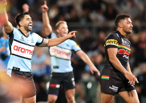 Shaun Johnson celebrates his match-winning field goal for Cronulla on Friday night.