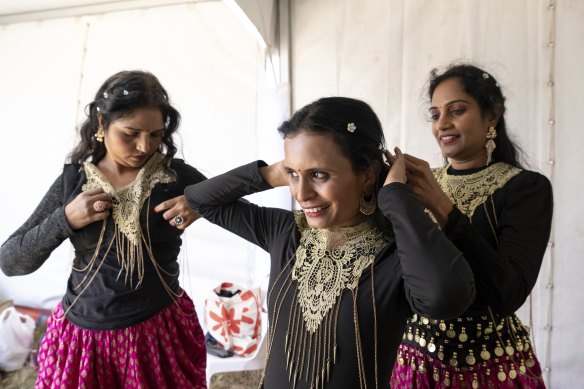Sahana Rudrappa, Sahlini Mendo and Lakshmi Esarapu from the Mastani Dance Group from Glen Waverley preparing for their performance backstage at the Wyndham Diwali festival.