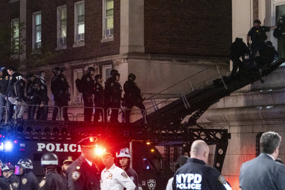 Using a tactical vehicle, New York City police enter an upper floor of Hamilton Hall on the Columbia University campus in New York after it was taken over by protesters.