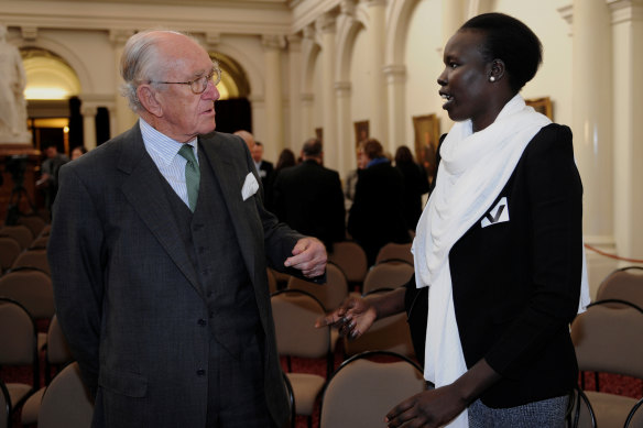 Nyuon talking to former Prime Minister Malcolm Fraser at the launch of Refugee Week in 2010.