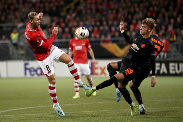Manchester United's Brandon Williams battles with AZ Alkmaar's Teun Koopmeiners.