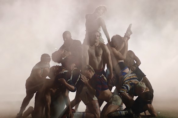 The scrum scene in the music video.