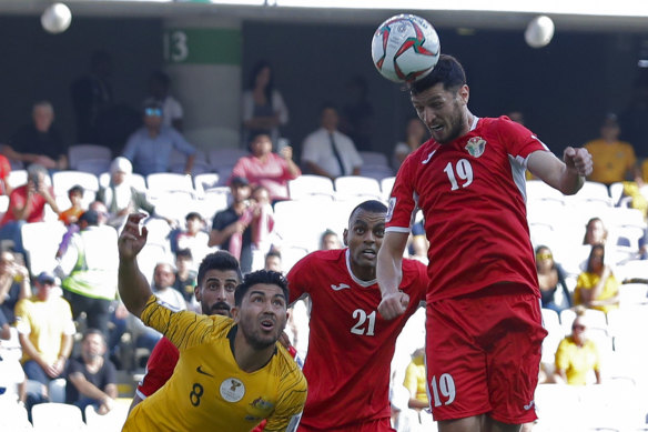 Head for heights: Anas Bani Yaseen heads home the winning goal for Jordan.