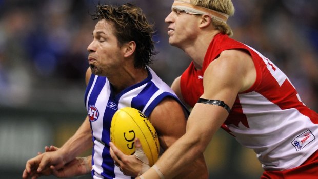Shannon Grant (left) playing for North Melbourne in 2008.