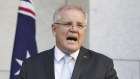 Australian Prime Minister Scott Morrison announces the $130 billion package to support workers with wage subsidies during a press conference to outline the government's economic response to the COVID-19 coronavirus pandemic, at Parliament House in Canberra on  Monday 30 March 2020.