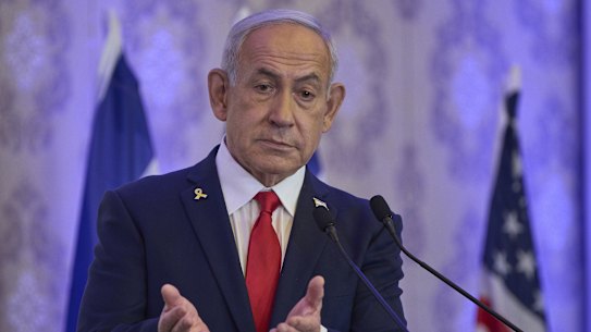 Israeli Prime Minister Benjamin Netanyahu speaks to the audience at a conference in Jerusalem, Sunday, July 27, 2025. (AP Photo/Ohad Zwigenberg)