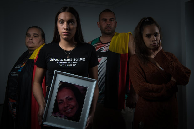 Tanya Day's children (L-R): Belinda Stevens, Apryl Watson (with pic of Tanya), Warren Stevens and Kimberly Watson.