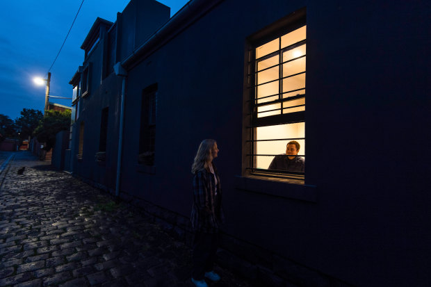 Close friend and neighbour Olivia McLeod making one of her regular visits to chat at Tom's window.