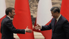 French President Emmanuel Macron shakes hands with Chinese President Xi Jinping during a visit last month.