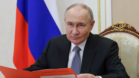 Russian President Vladimir Putin works at the Kremlin on Friday.