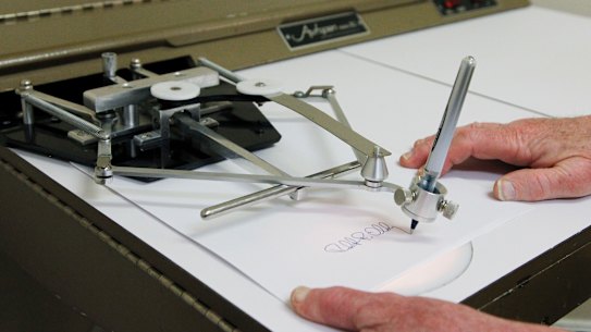 An automatic signing machine, known colloquially as an autopen.