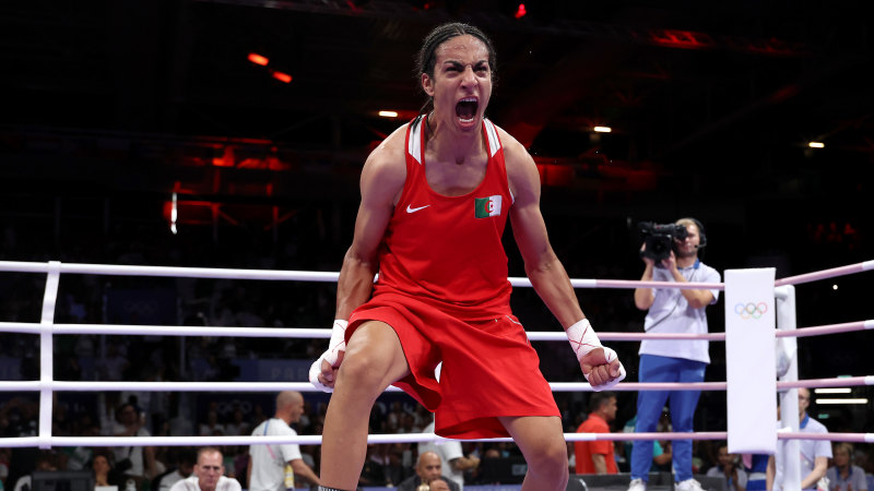 Algerian boxer at centre of gender storm breaks down in tears after win
