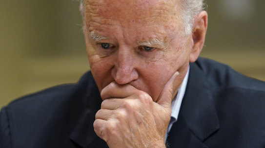 President Joe Biden listens during a briefing with first responders in Miami on Thursday.