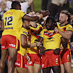 The Kumuls celebrating Dudley Dotoi’s try.