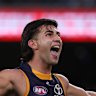 Josh Rachele of the Crows celebrates a goal.