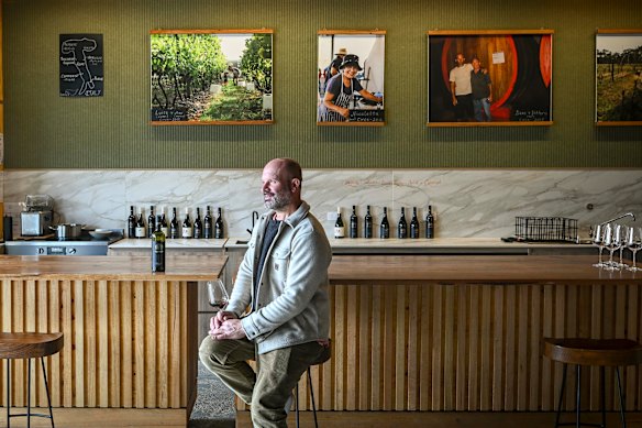 Winemaker Dino Giammarino at his cellar door in Healesville, where he also sells wetsuits.