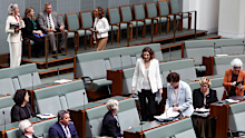 Andrew Wallace MP and Pat Conaghan cross the floor and sit with the cross bench during debate of the Gambling Reform Bill.