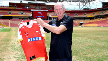 Wayne Bennett with the new jersey to be worn by the Dolphins.