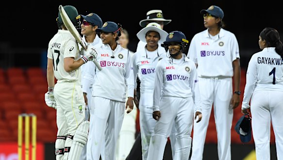 Meg Lanning speaks to India captain Mithali Raj before declaring a draw.