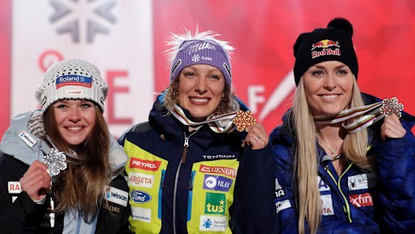 Second-placed Corinne Suter of Switzerland (left), winner Ilka Stuhec of Slovenia and Vonn during the medal ceremony.