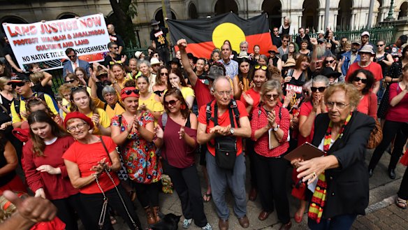 Wangan and Jagalingou traditional owners and their supporters protesting outside Parliament House in Brisbane in March last year. 