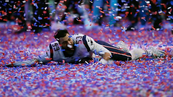 New England's Kyle Van Noy celebrates in confetti after game.