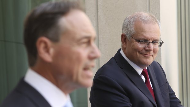 Health Minister Greg Hunt (left) has distanced himself from the internal ructions, which threaten to draw in Prime Minister Scott Morrison.  