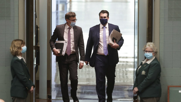 Ministers Alan Tudge and Michael Sukkar wearing masks on arrival for Question Time on Monday.