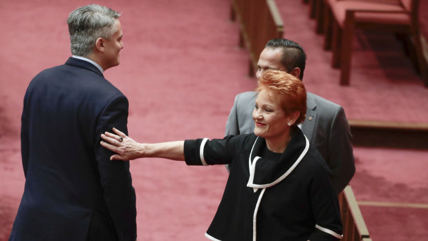 Finance Minister Mathias Cormann and One Nation leader Pauline Hanson part ways after the government's company tax cuts were voted down on Wednesday.