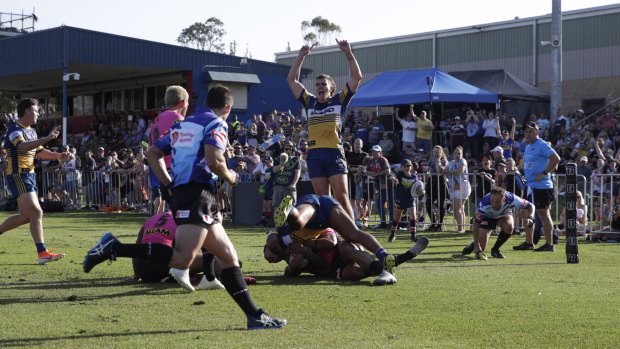 The Eels celebrate a last-minute try against the Panthers in Bega on Saturday.