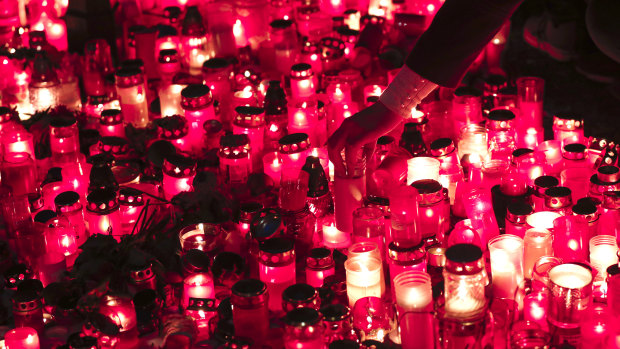 People light candles in Prague, Czech Republic, on Sunday while celebrating the 30th anniversary of the pro-democratic Velvet Revolution that ended communist rule in 1989. 