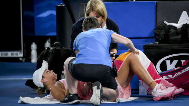 Barty receives treatment during a medical time-out in her third-round clash.