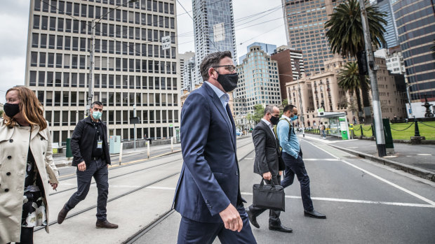 Premier Daniel Andrews and his deputy, James Merlino, walk to Parliament in October last year.