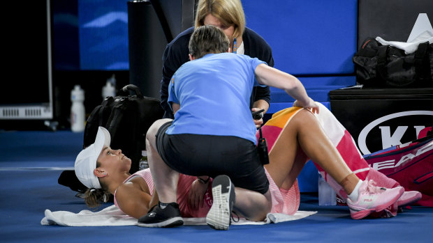 Ashleigh Barty receives treatment during her second-round match.