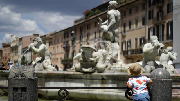 A child admires the 1575 Fontana del Moro in Rome's Piazza Navon.