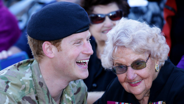 Prince Harry shares a laugh with Daphne Dunne during his visit to the Sydney Opera House.