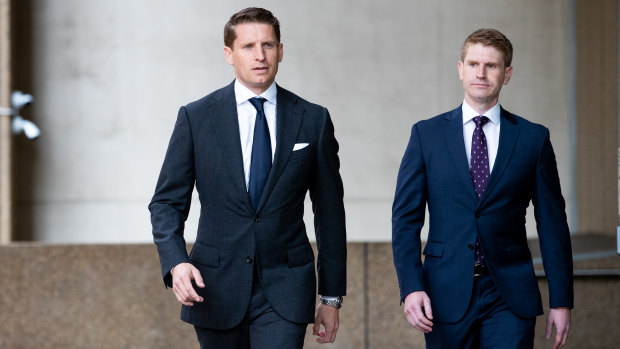 Assistant Defence Minister and federal Liberal MP Andrew Hastie (left) outside the Federal Court on Friday.