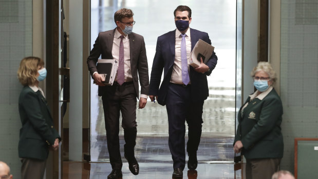 Ministers Alan Tudge and Michael Sukkar wearing masks on arrival for Question Time on Monday.