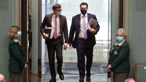 Ministers Alan Tudge and Michael Sukkar wearing masks on arrival for Question Time on Monday.