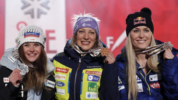 Second-placed Corinne Suter of Switzerland (left), winner Ilka Stuhec of Slovenia and Vonn during the medal ceremony.