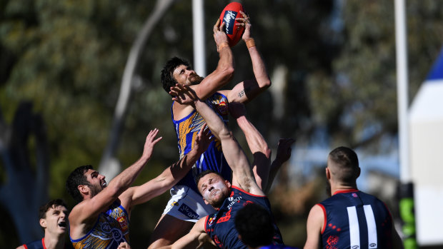 High flier: West Coast forward Josh Kennedy rises above the pack.