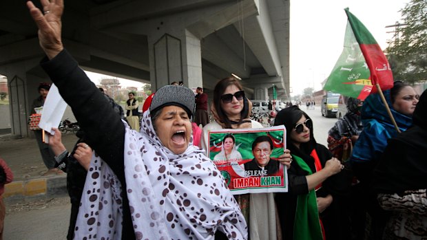 Supporters of imprisoned former prime minister Imran Khan chant during a protest in Peshawar condemning the court verdict.