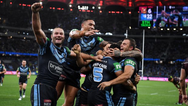 Blues celebrate after streaking to victory over Queensland.