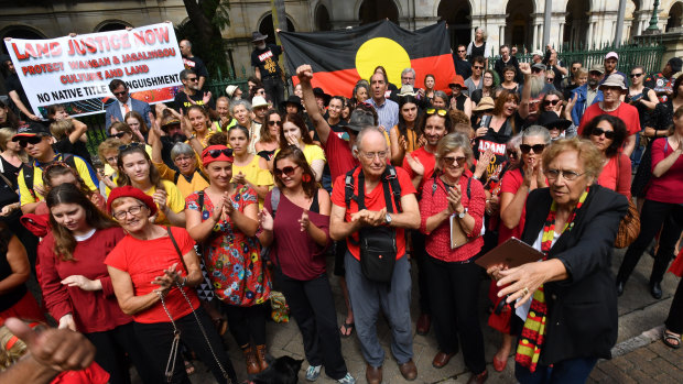 Wangan and Jagalingou traditional owners and their supporters protesting outside Parliament House in Brisbane in March last year. 