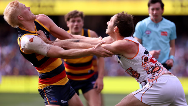 Elliott Himmelberg competes with Jeremy Finlayson. The Giants outmuscled the Crows throughout Saturday’s clash.