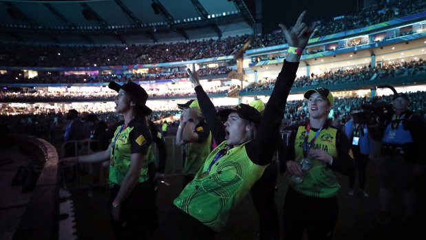 Big hit: Ellyse Perry and her Australian teammates watch singer Katy Perry's encore performance after the final.