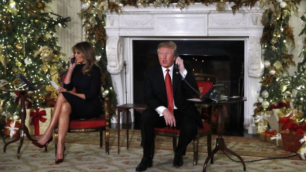 Donald Trump and first lady Melania Trump talking to children on Christmas Eve to share updates on Santa's movements from the North American Aerospace Defense Command (NORAD) Santa Tracker on Christmas Eve.