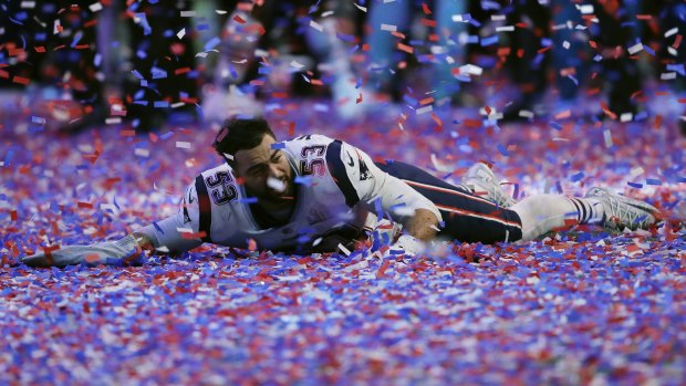 New England's Kyle Van Noy celebrates in confetti after game.