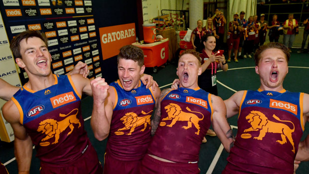 Dayne Zorko (second from left) and his Lions teammates celebrate their win over Geelong in round 22.